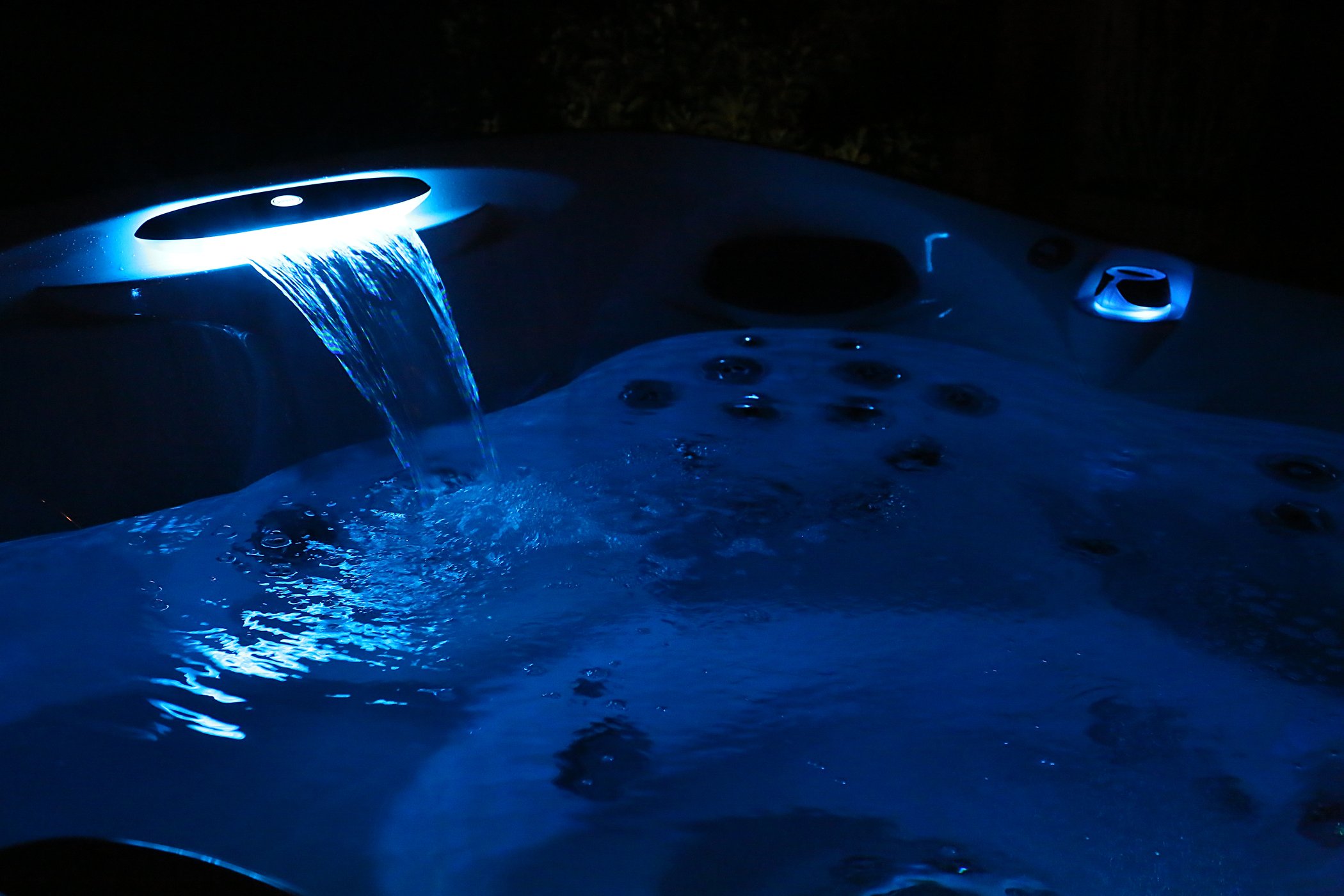 Hot tub water illuminated at night